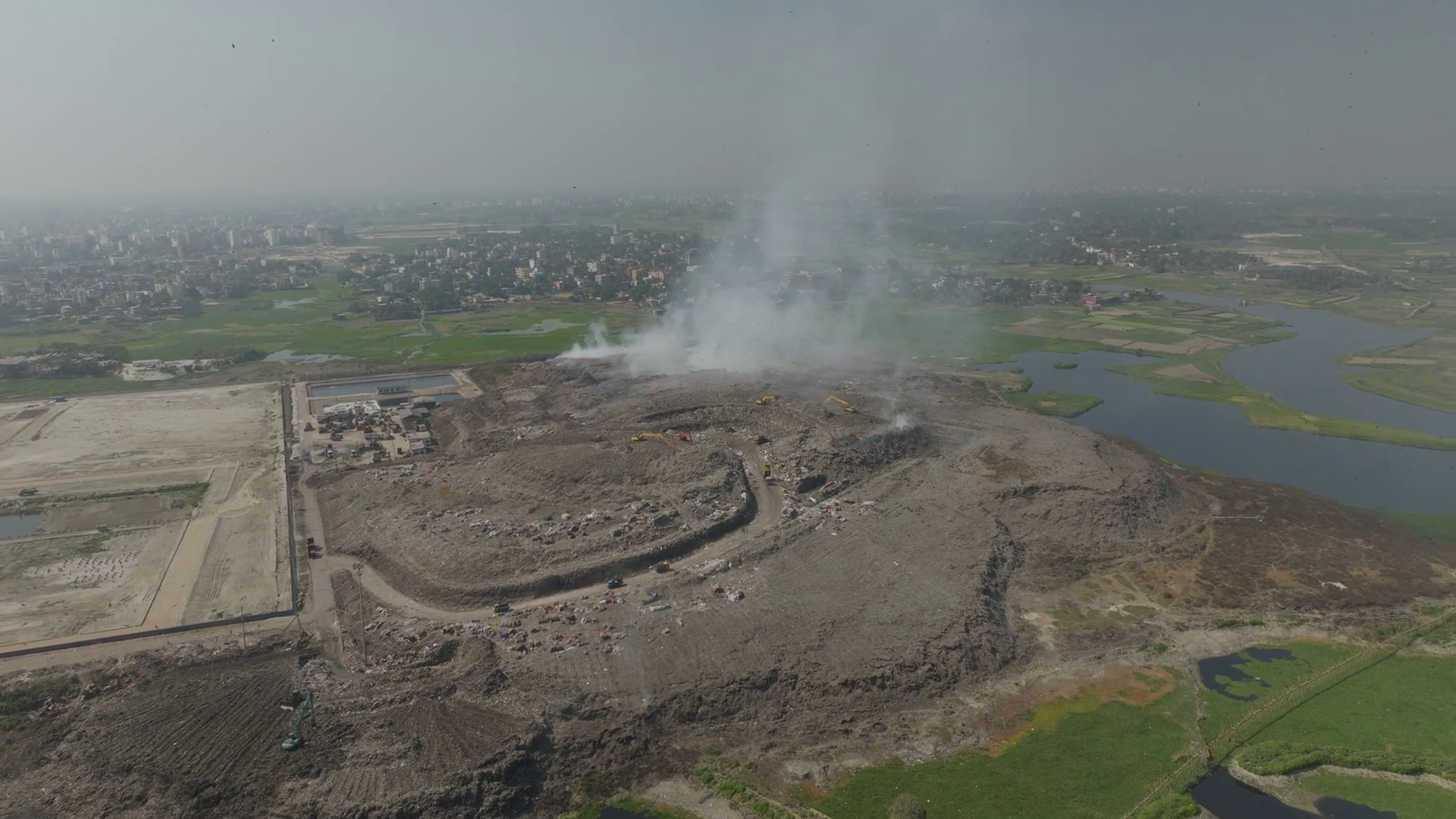 Aerial View Of Landfill Site With Smoke Stock Footage SBV-351898919 ...