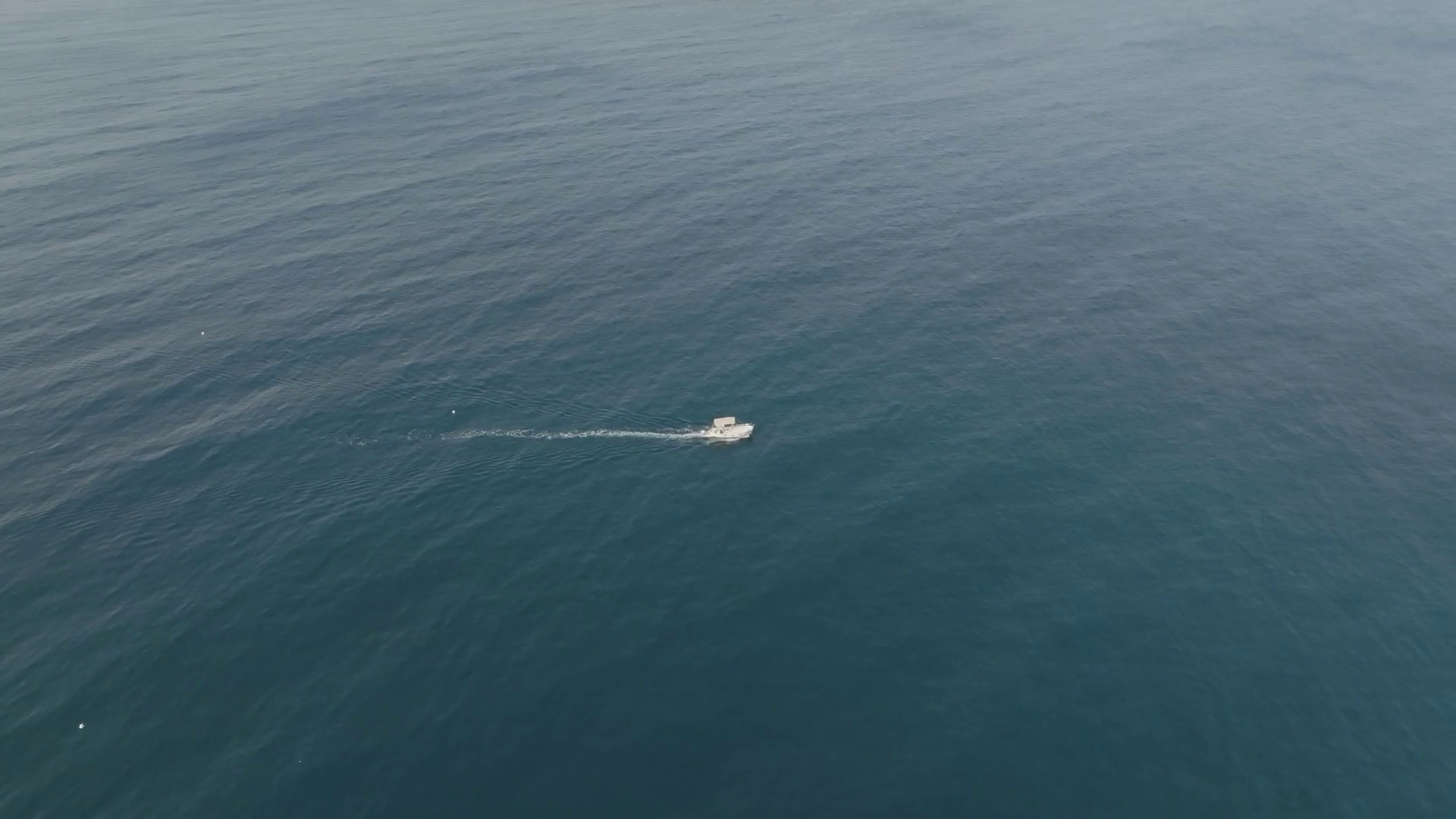 Aerial View Of Motorboat Sailing Along Coast Stock Footage SBV ...
