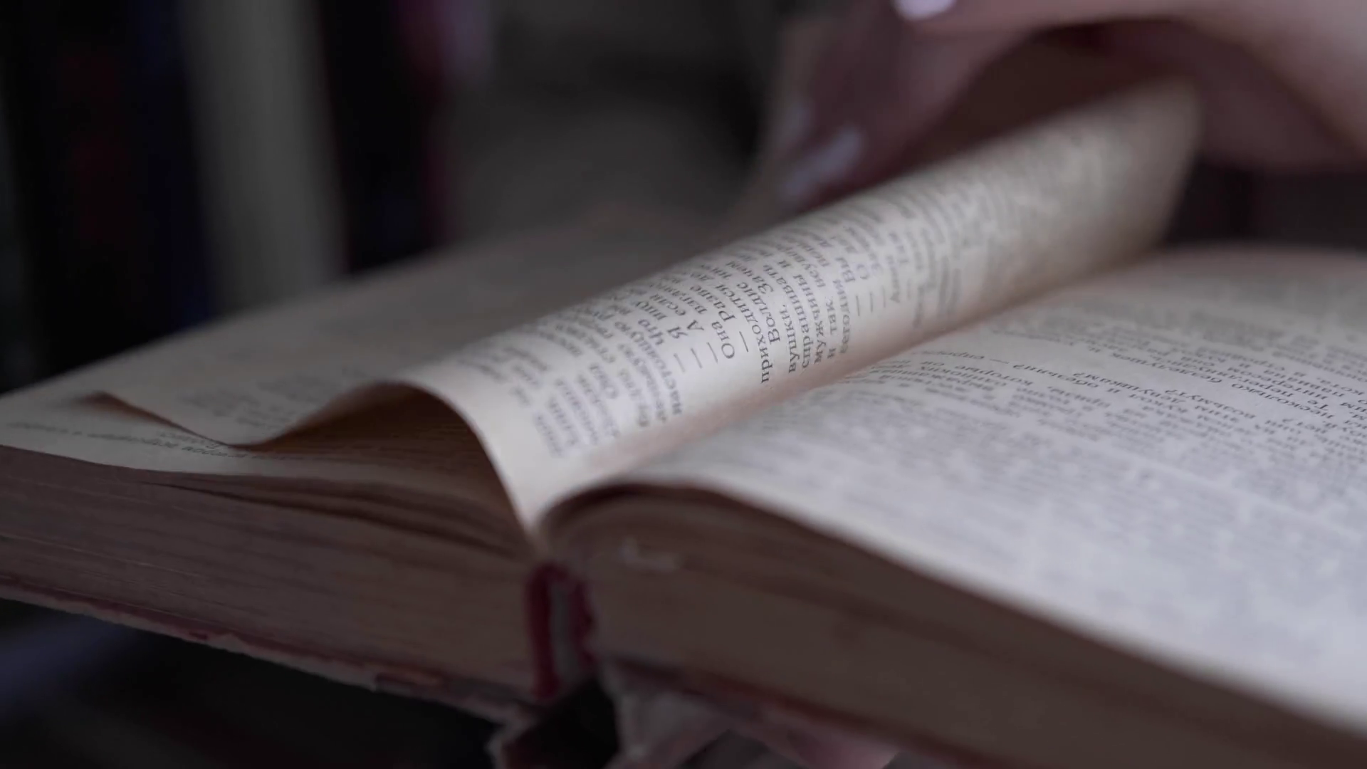 Woman leafing through pages of a book Stock Video Footage Storyblocks
