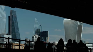 Slow motion shot of silhouetted commuters walking in Central London, England, UK