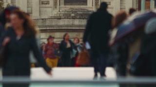 Multigenerational, multi ethnic anonymous crowds walking in the Millennium Bridge in London, England, UK