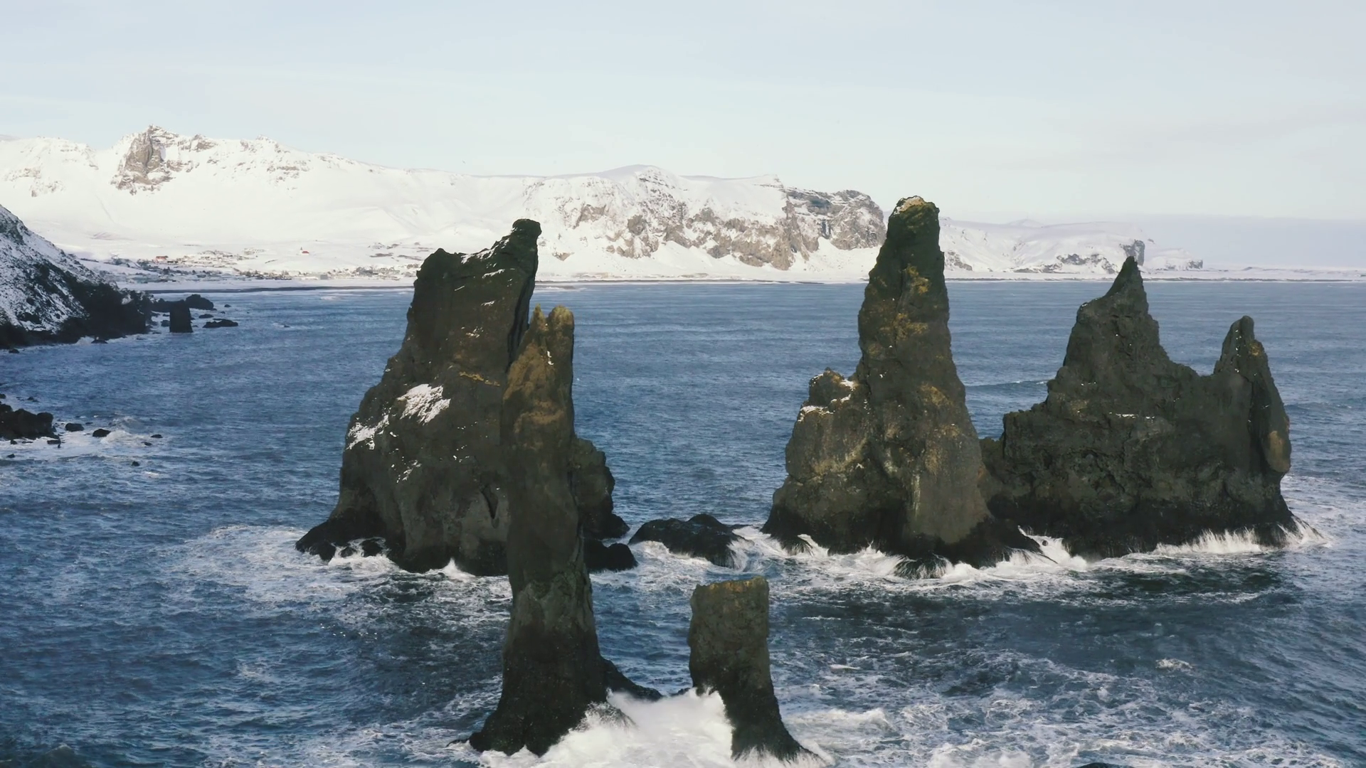 Aerial footage of troll toes on Reynisfjara black sand beach