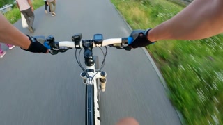 Explore city streets while cycling through vibrant urban life and nature