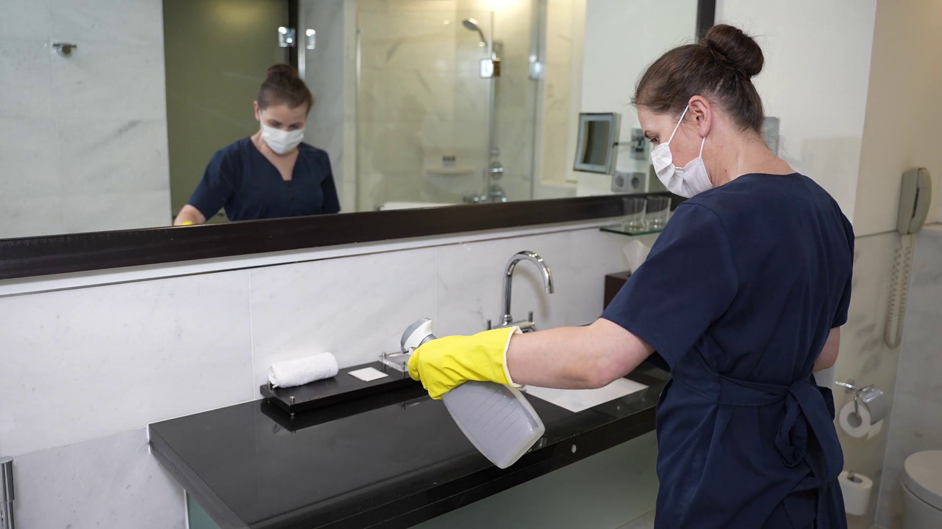 Masked Maid Spraying Wiping Sink Surface Stock Footage SBV346426246