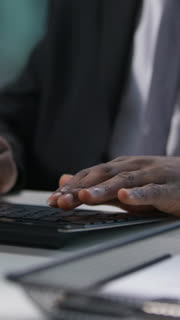 Close up focused concentrated African American man businessman business male ethnic guy office worker manager employee typing computer