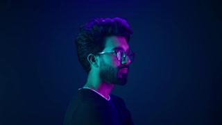 Portrait Indian serious man developer coding worker programmer profile looking to side turn head internet technology hacker male in glasses
