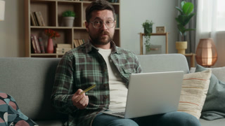 Caucasian client man male customer guy buyer buying online shopping laptop computer buy purchase store shrug shoulders puzzled problem