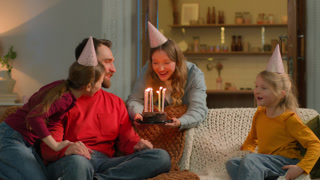 Happy birthday event Caucasian family mom children congratulate dad surprise birth party cheerful parents little girls kids daughters