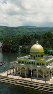 Vertical view of beautiful Linuk Masjid a mosque beside the Lake Lanao in Lanao del Sur. Mindanao, Philippines.