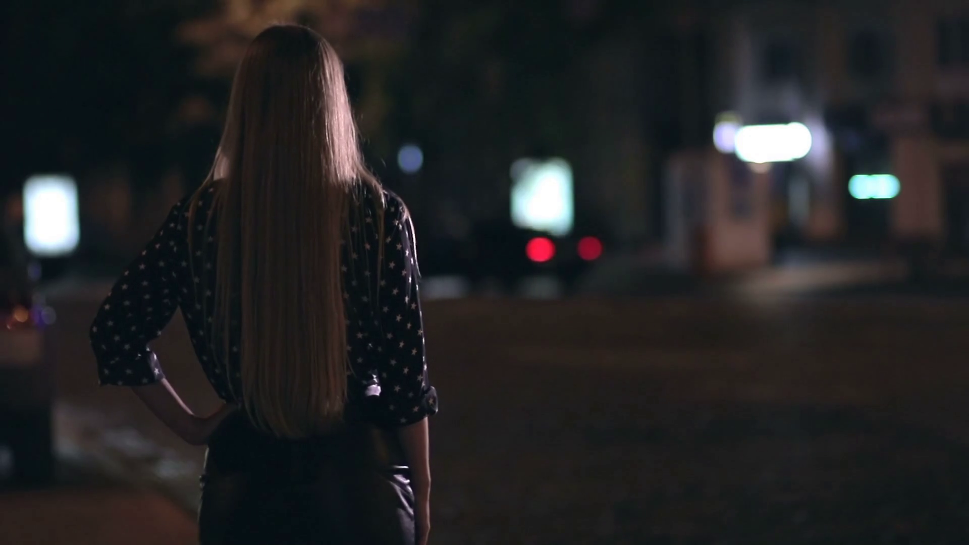 Charming girl hitchhiking on town street at night Stock Video Footage