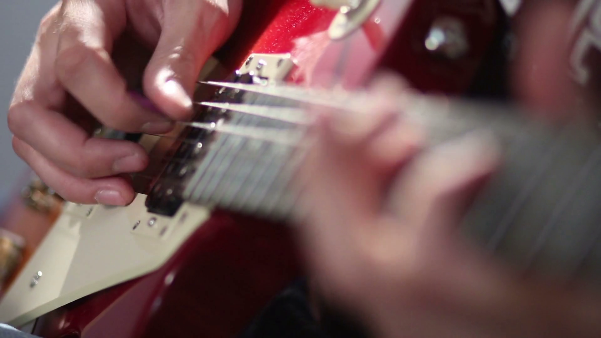 Guitarist hand strumming at electric guitar string Stock Video Footage