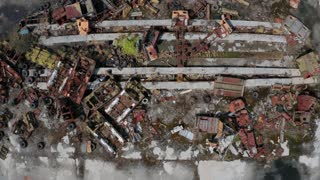 Aerial Shot Of Car Dump In Chernobyl Zone Pile Of Radioactive Metal Trash Car Cabs Change Houses Used During Liquidation Of Accident At Nuclear Power Station Drone Shot Of Wrecked Auto Junkyard