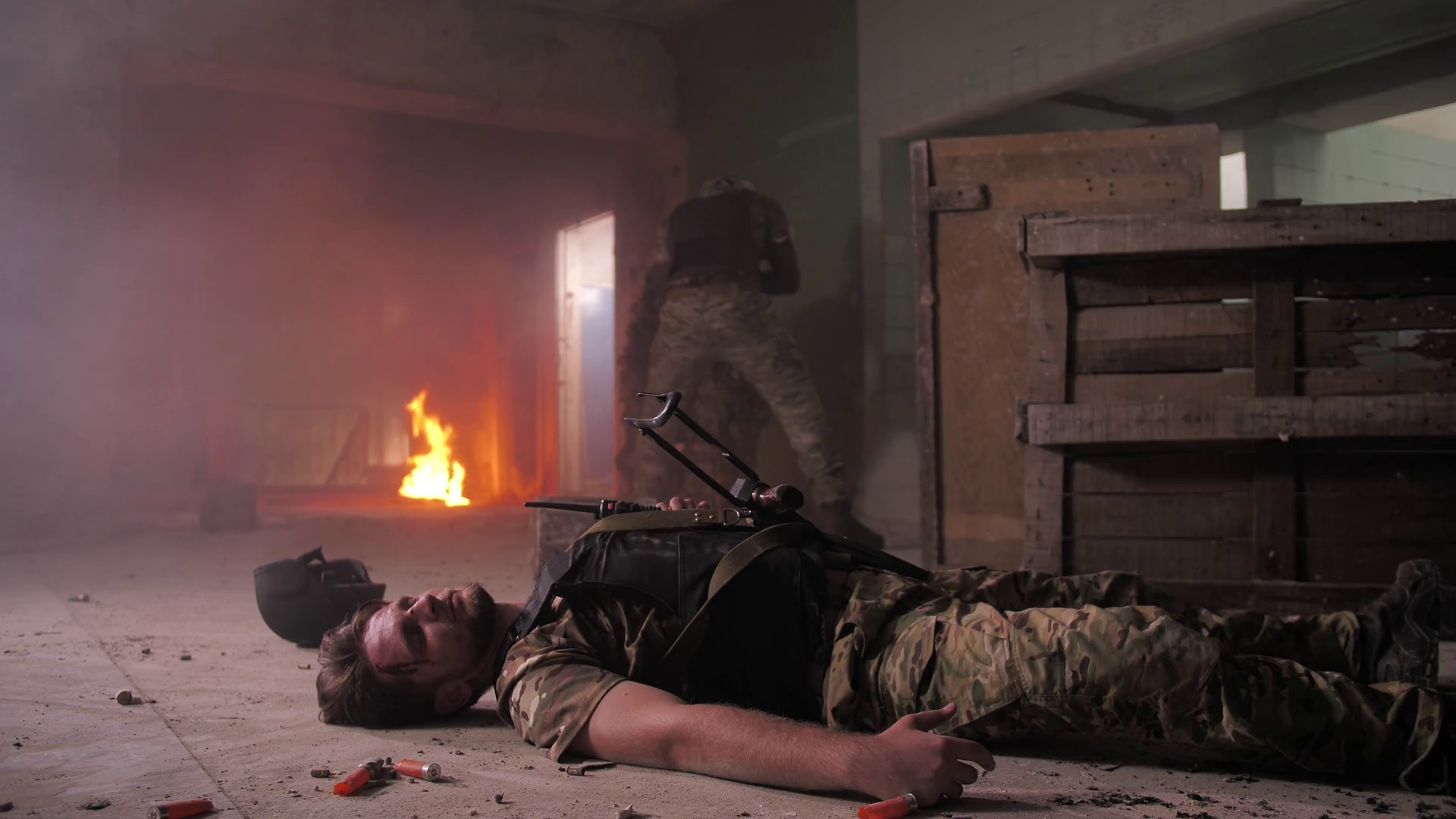 Brave military man evacuating seriously wounded in head fighter from