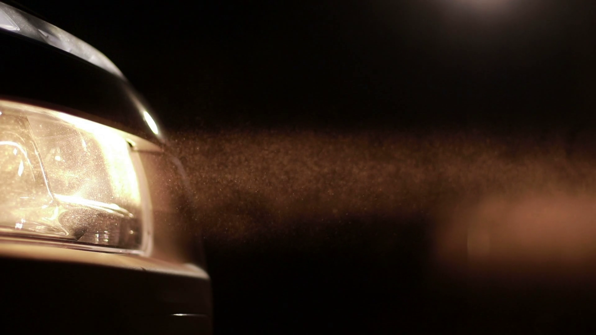 Bright car headlights in clouds of dust at night Stock Video Footage