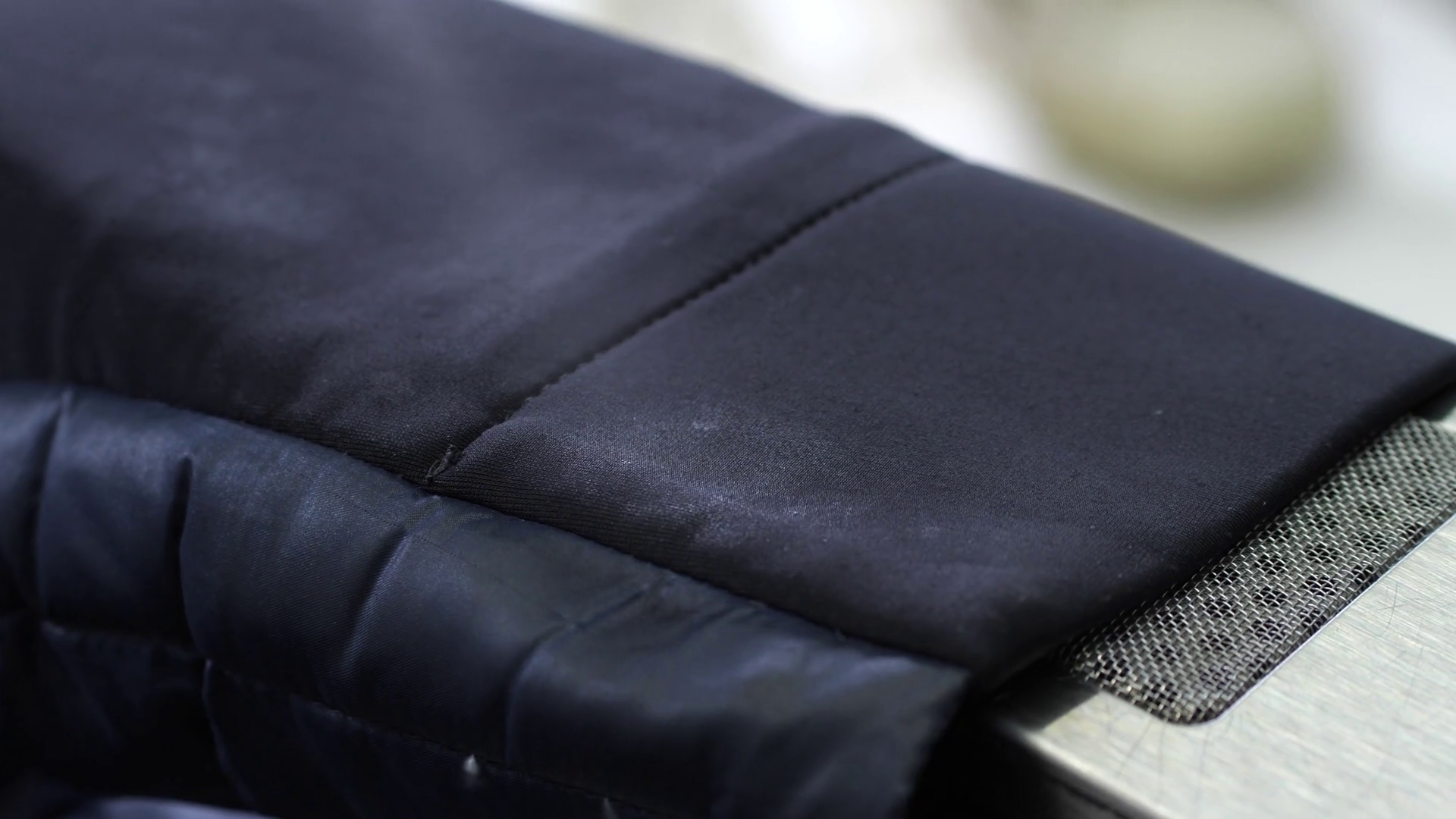 Closeup of suit jacket sleeve cleaned with stain remover and dried