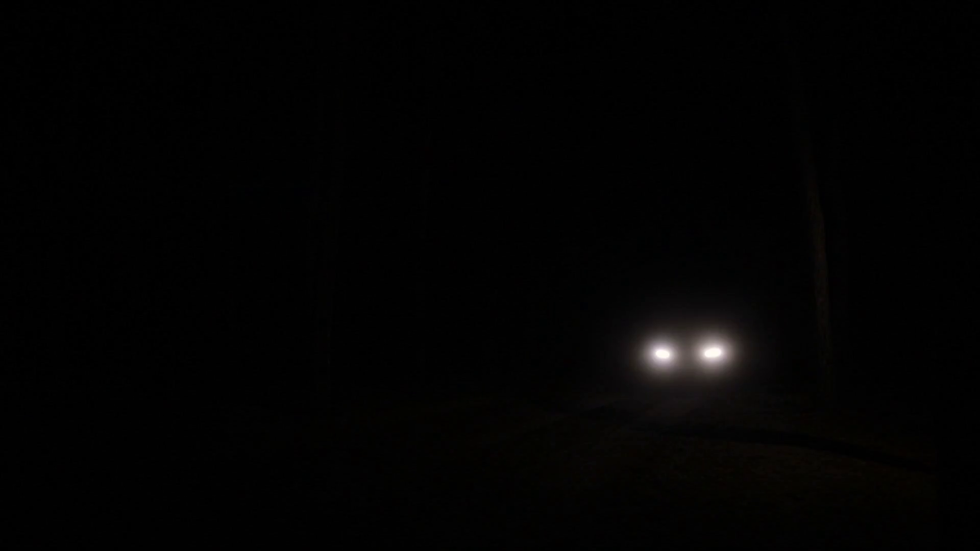Headlights Of Car Approaching On Dark Road Stock Footage SBV316926769