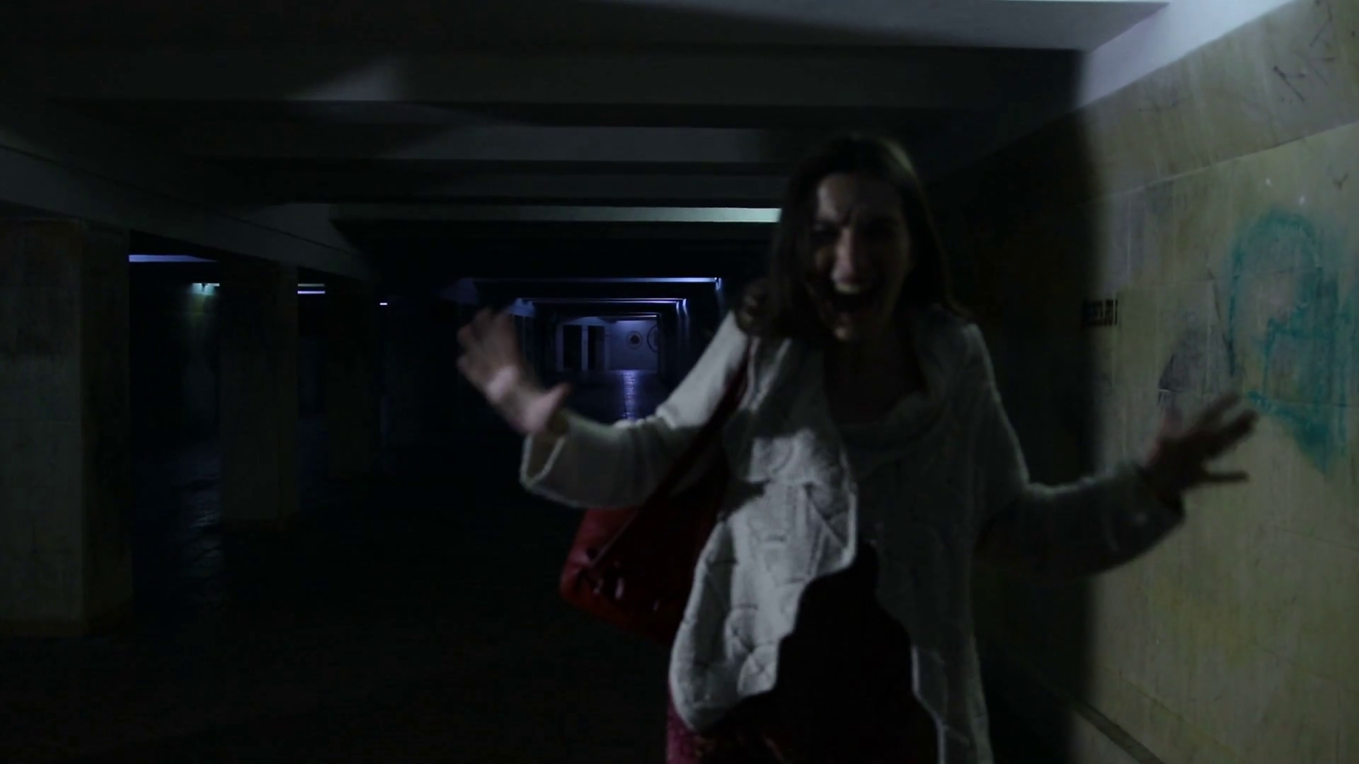Scared woman screaming in dark underpass at night Stock Video Footage