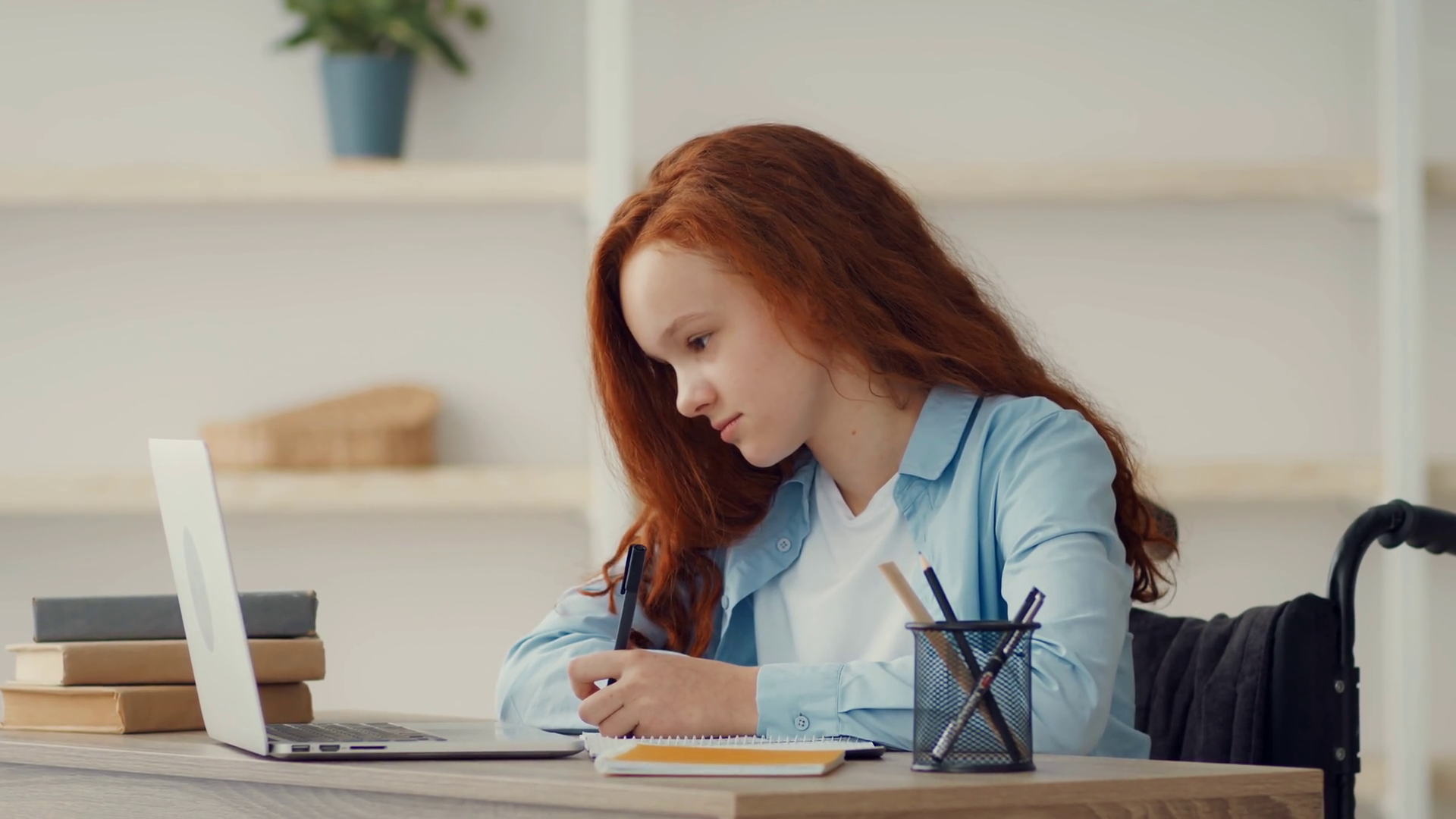 A Girl With Long Red Hair Sits At Wooden Stock Footage SBV-351942253 ...