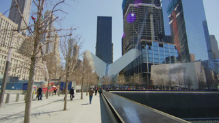 People by the memorial pool in the 9/11 memorial park