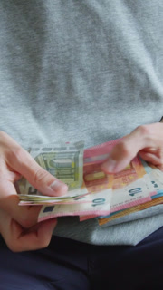 Vertical Young Man Counting His Last Euro Money Bills And Notes During Inflation