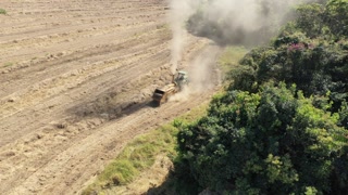 Aerial scenery of farming landscape at rural countryside. Green background and field scene with tractor.