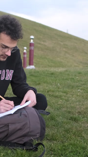 Writing activity on paper on the, working environment outside on summer days, writing poetry in the park