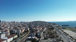 Aerial view of a city with a coastline from the coastline, a drone shot of the city, the view of the city after snowfall