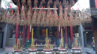 Candle smoke in a temple in Vietnam. 4K