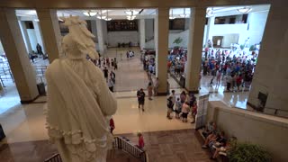 View from behind the State of Freedom onto the floor of the US Capitol Visitor’s Center showing all the tourists.