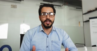 Arabic businessman participates in virtual meeting to solve business-related matters