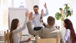 During business training all participants raise hands voting unanimously