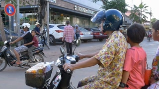 SIEM REAP, CAMBODIA - NOV 2015: People on motor bike