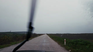 Moody Road Trip Landscape With Raindrops On Car Window Glass 3
