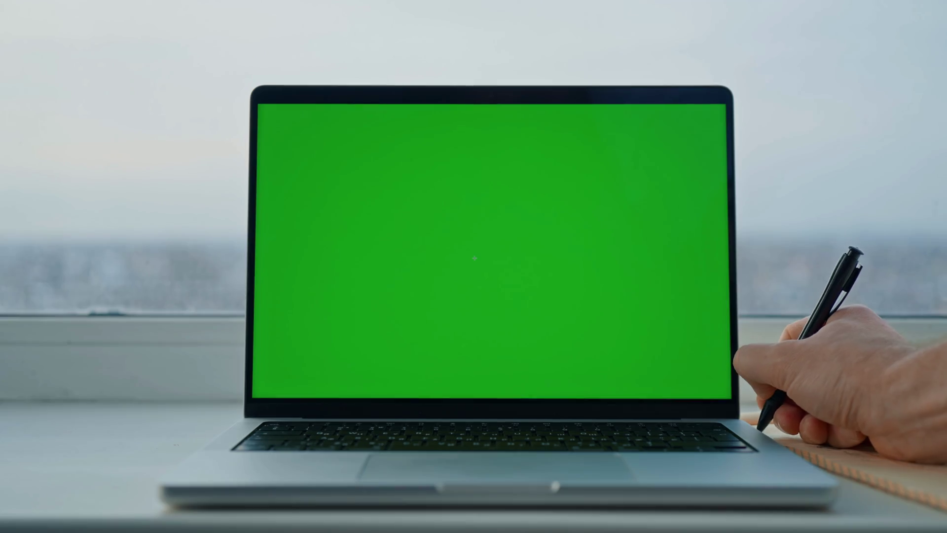 man-writing-in-notebook-near-laptop-with-stock-footage-sbv-347594481