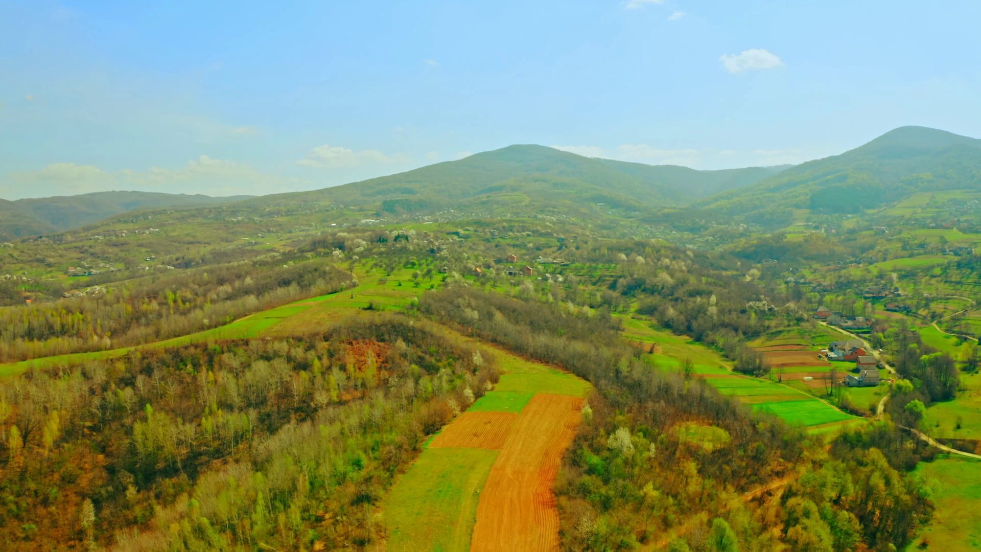 aerial view on rural landscape in mountains area agricultural fields