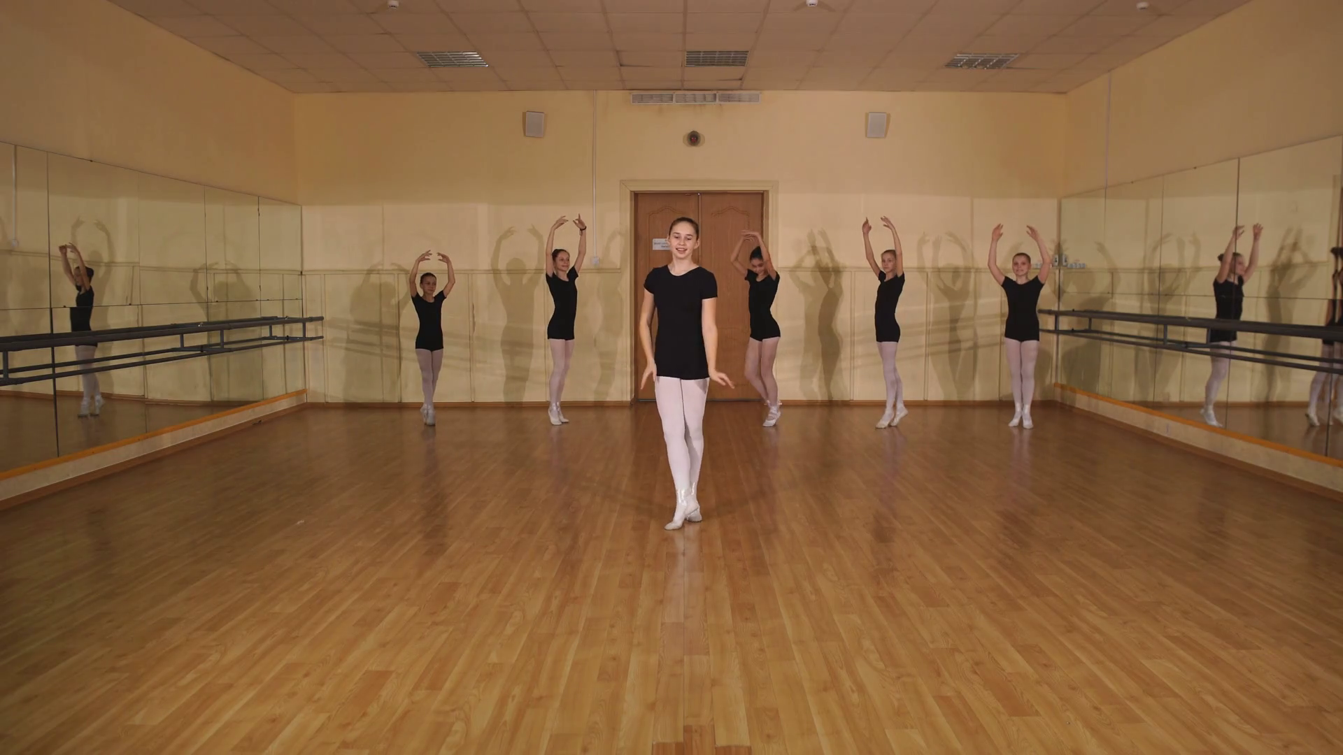 group of four young ballerinas standing in row and practicing ballet Stock Video Footage 00:11 