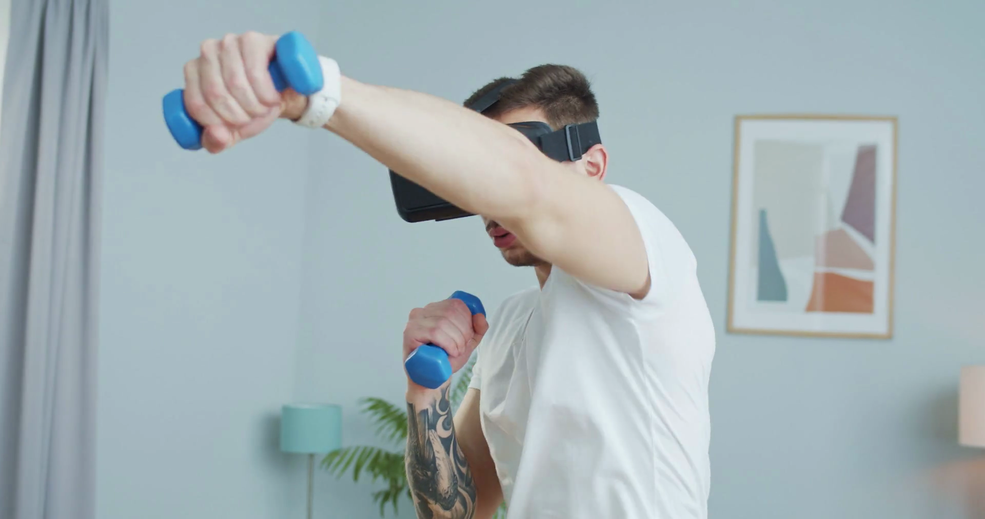 Close up Caucasian athletic fighter training online in vr goggles at