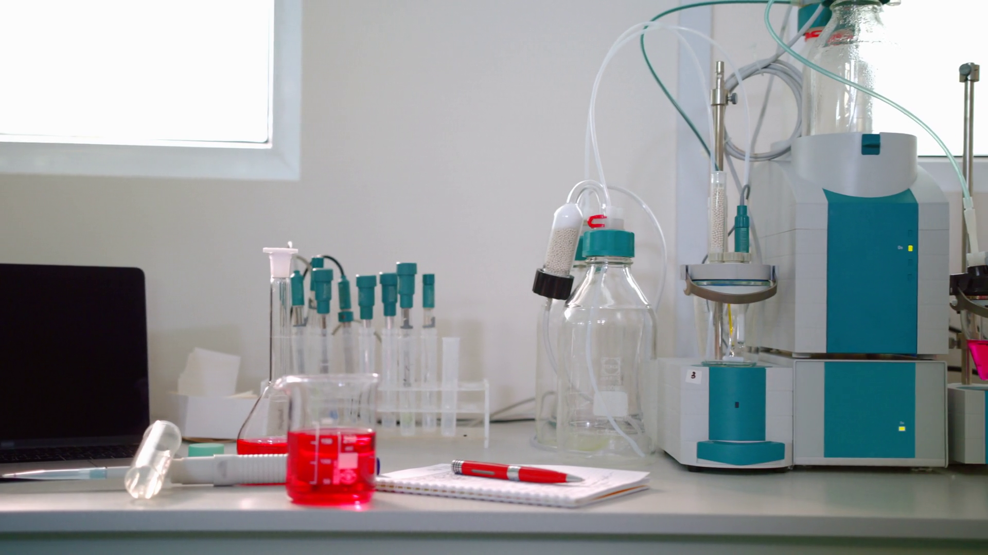 Science lab equipment panning on. Automatic titrator in biotechnology