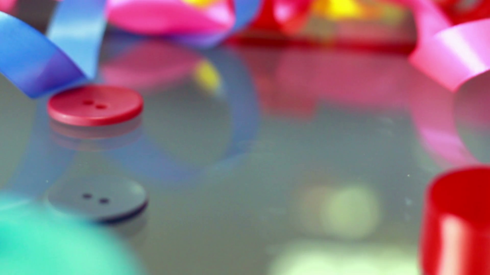 Sewing Buttons Falling On Glass Table Stock Footage SBV306546632