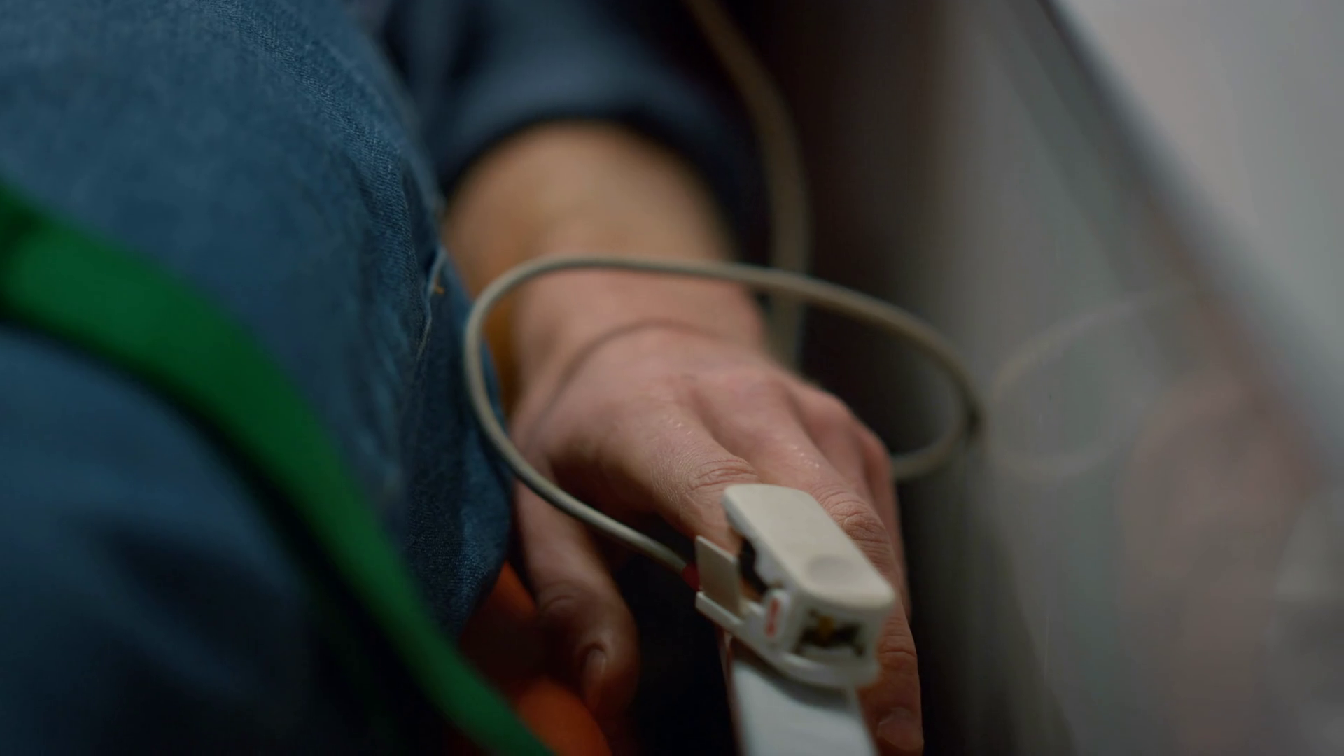Man patient checking patient oxygen blood level with oximeter in ambulance car. Closeup male