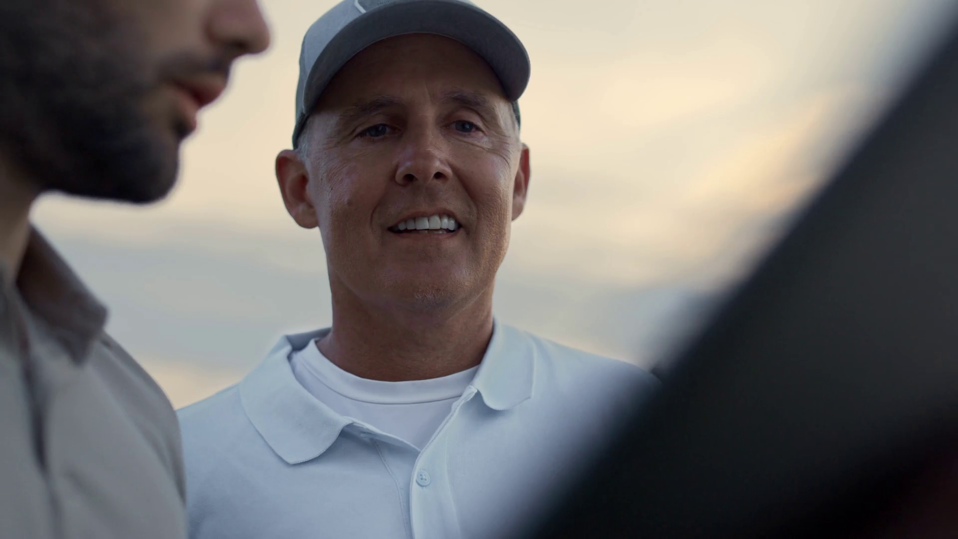 Wealthy golfers looking tablet on online video chat. Portrait of rich