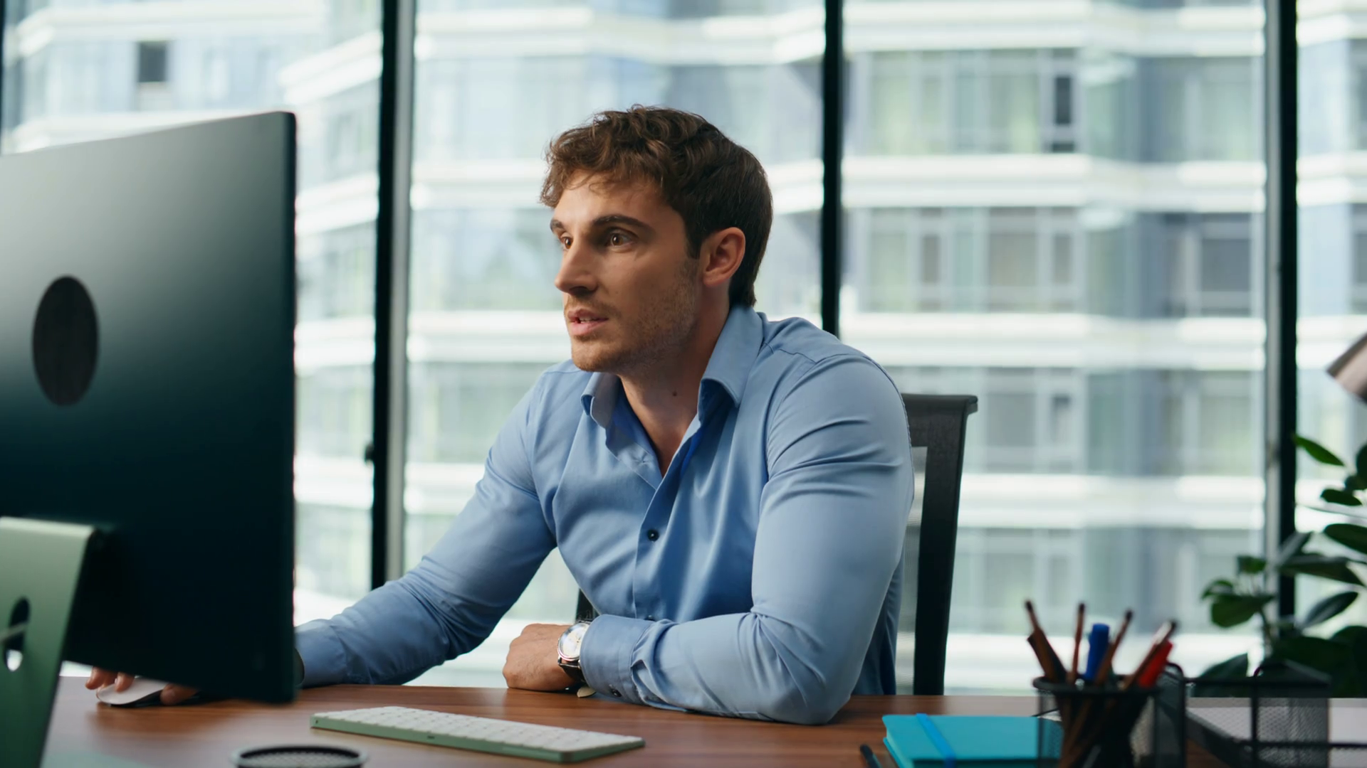 Young hardworking businessman celebrate profit growth looking at ...