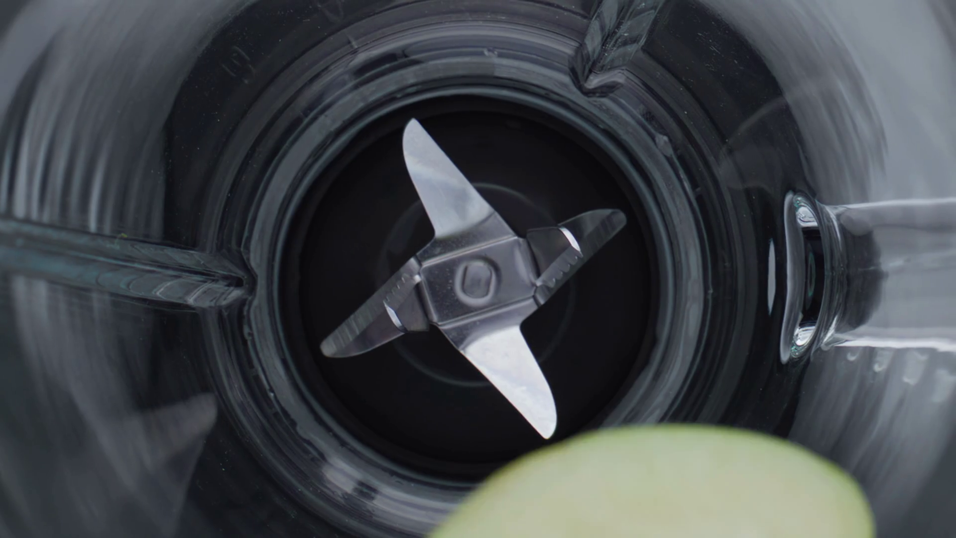 Sliced fresh ingredients for smoothie falling into blender bowl with