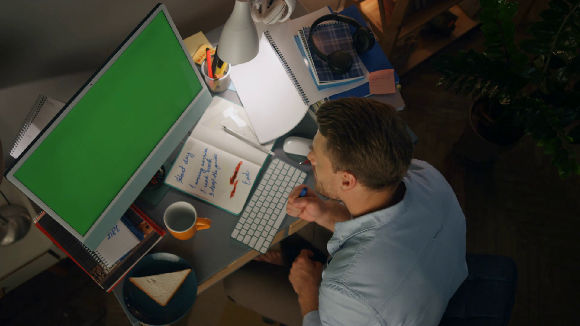 Charismatic man performing song at night apartments top view. Emotional guy singing in online