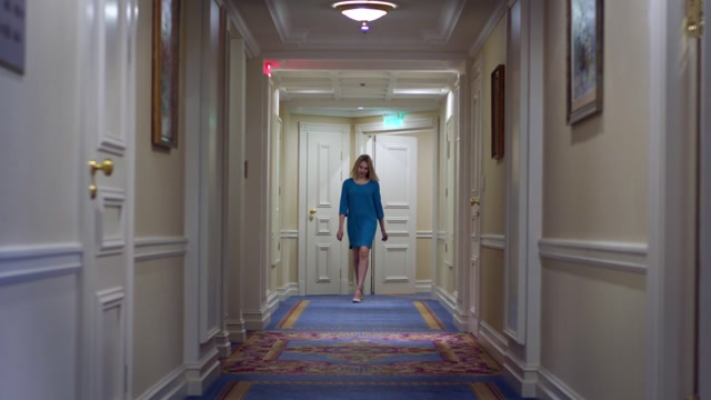 Woman Walking Down Hotel Hallway Stock Footage: Royalty-Free Video ...