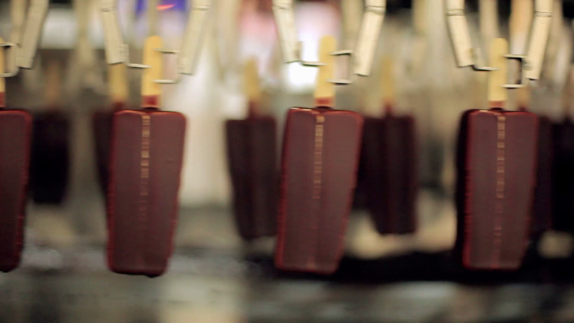 Chocolate ice cream manufacturing line. Food processing plant. Desserts