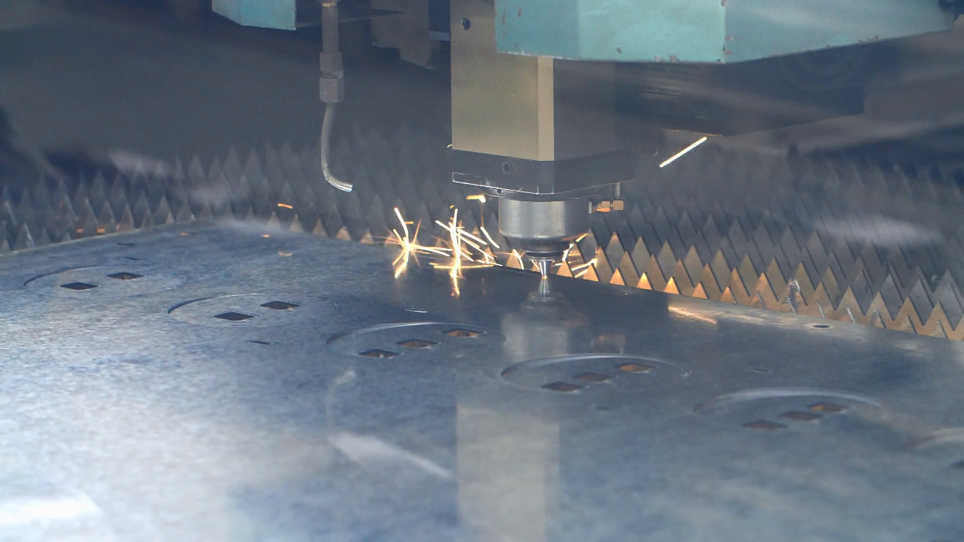 CNC fiber laser cutting equipment. Use of hightech equipment in heavy