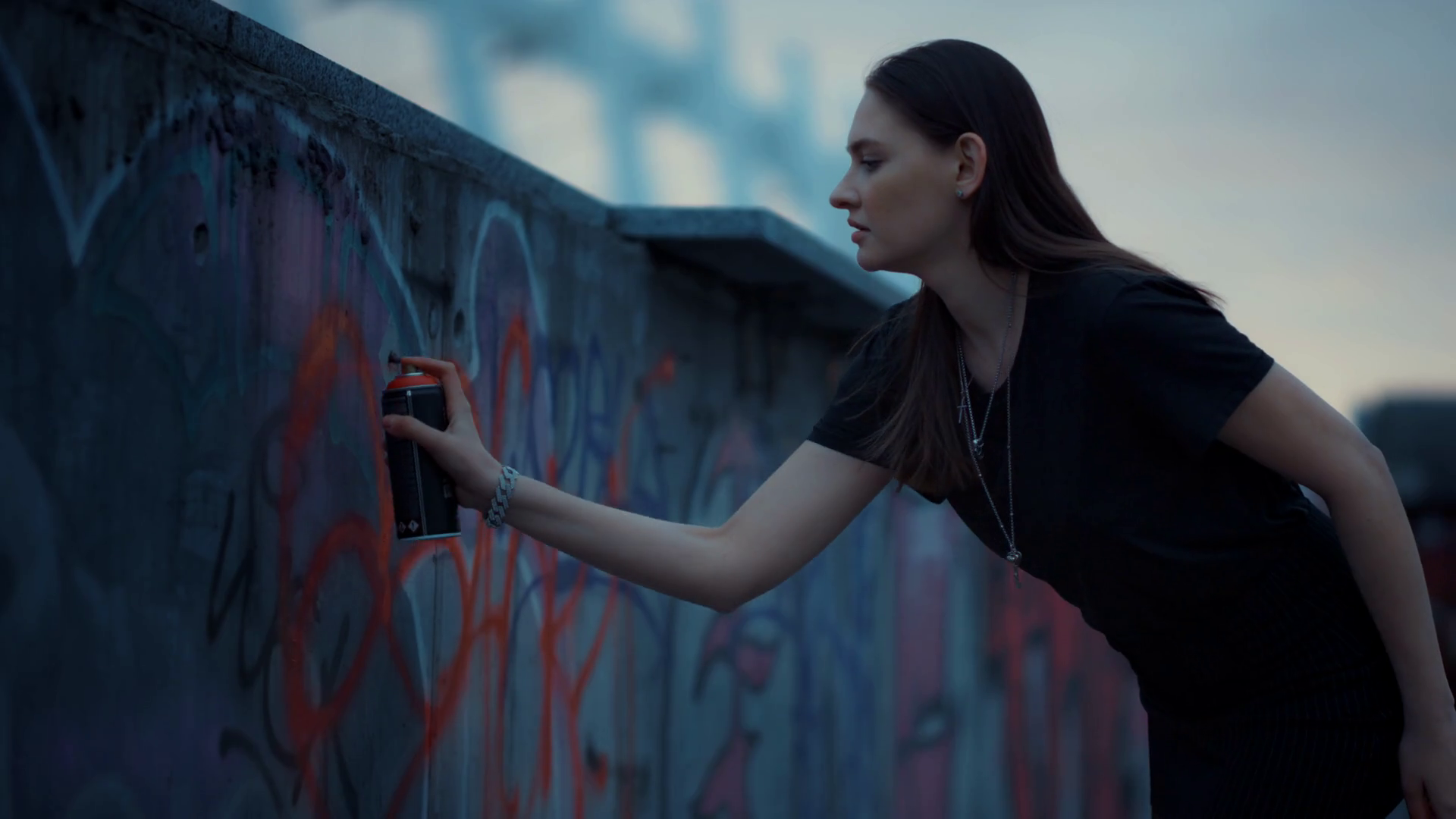 Focused Girl Drawing Graffiti With Spray Paint On Street Wall Pretty Woman Using Aerosol Paint For Graffiti Female Artist Painting Red Heart On Wall Talented Girl Drawing Picture On Building Stock Video