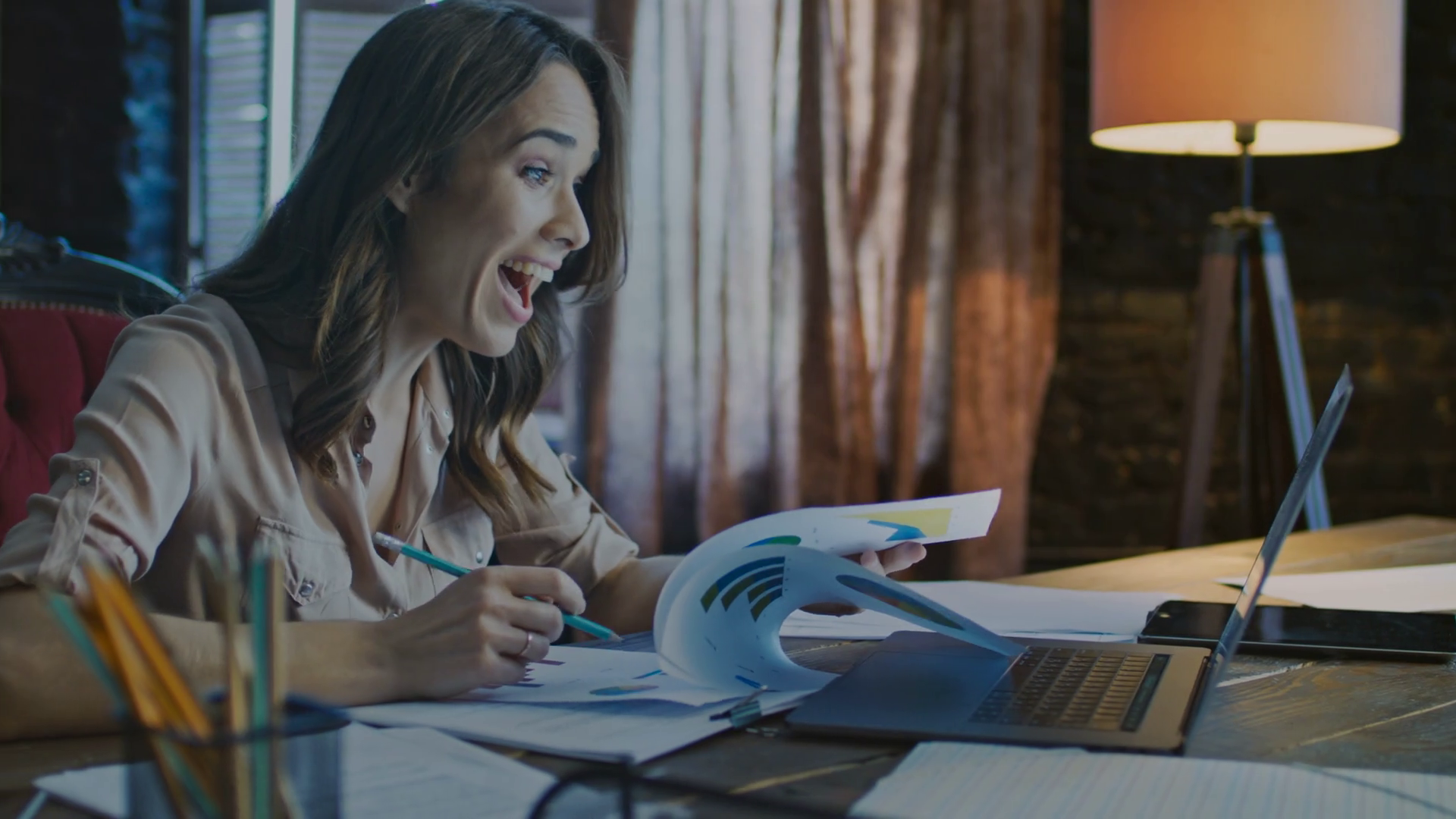 Happy business woman shocked on good news on laptop screen. Successful
