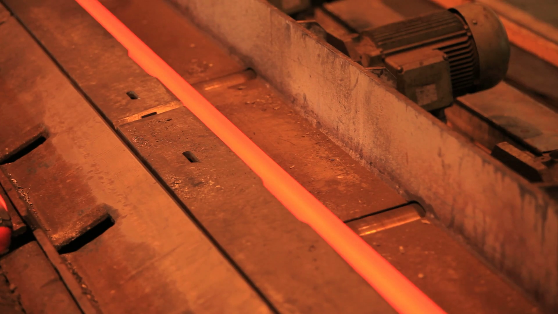 Iron pipe production process. Steel pipes moving on production line at